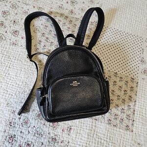 Coach mini court backpack in black.